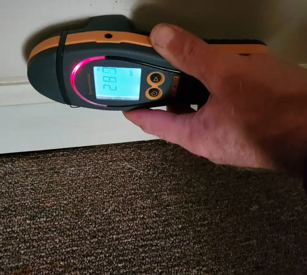 Moisture detection at baseboard during Storm Damage Restoration in Garden Acres